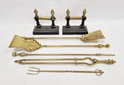 Pair iron and brass fire dogs with turned finials and five brass fireside implements
