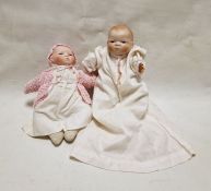 Two Bye-Lo bisque headed baby dolls by Grace Storey Putnam (1924-1925), each with sleeping brown
