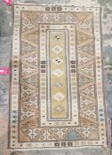 Anatolian Milas ochre ground rug with seven central lozenges, multiple geometric and floral