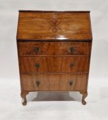 Reproduction mahogany and walnut veneered bureau with drop enclosing pigeonholes and drawers,