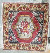 Pair of Eastern style red ground rugs with central floral medallion, floral border, one worn 67cm