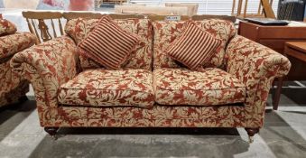 20th century red damask two-seater sofa on turned supports and castors
