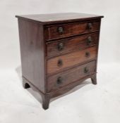 19th century mahogany chest of four long drawers with brass lion hoop handles, on splayed