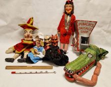 Collection of early carved and painted wood and cloth puppets to include Mr. Punch, Judy, devil,