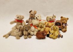 Three various early 20th century miniature plush teddy bears, one possibly with bottle interior,