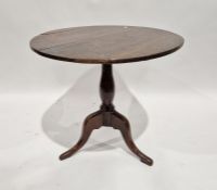 19th century mahogany tilt-top table, the circular top on turned baluster pedestal and tripod