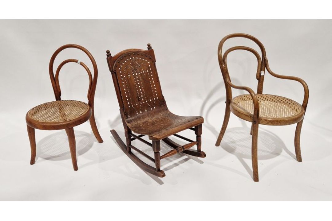 Child's bentwood and cane-seated chair, another child's bentwood cane-seated armchair and a child'