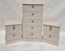 Pair of modern cream-coloured bedside chests, 46cm wide and a matching chest of six drawers, 62cm