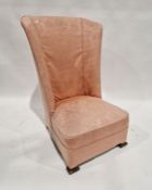 Edwardian Arts & Crafts-style nursing chair with high back, pink upholstery