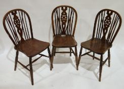 Set of six stained wood Windsor, wheel and rail back dining chairs (6)