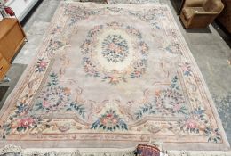 Large Chinese mushroom ground superwash carpet with central floral medallion, floral border 366cm