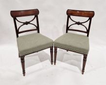 Set of four mahogany slatback dining chairs with green upholstered seats and another three with