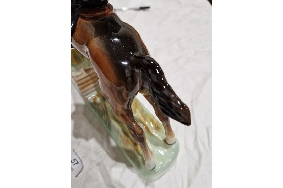 Beswick pottery model of a horse and rider jumping a fence, printed black marks, the female rider - Image 8 of 17