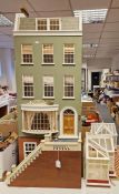 Large Georgian-style painted Anglesey wood dolls house with conservatory, orangery, flight of steps,