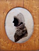 Pair of Regency portrait silhouette miniatures in bird's eye maple frames