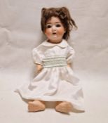 Heubach bisque headed doll with sleeping blue eyes and moulded composition body, 59cm