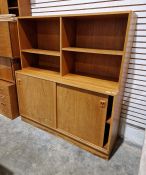 Mid to late 20th century teak wall unit with shelves above sliding cupboards below