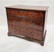 Walnut chest of three long drawers with brass swan neck handles, on bracket feet, 81 cms h. x 97cm