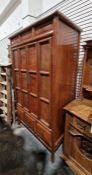 20th century walnut Oriental-style cabinet with folding panelled doors, three drawers to base