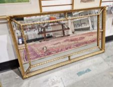 Regency giltwood framed wall mirror, rectangular with applied stiffleaf moulding and gadrooned