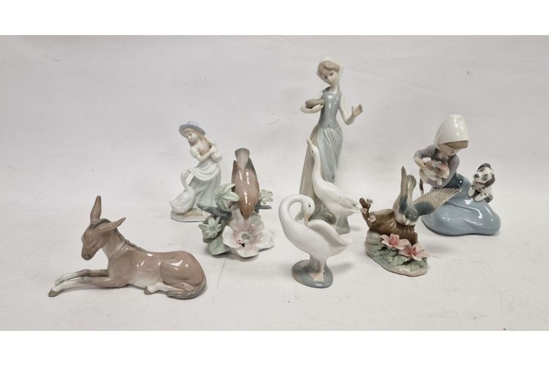 Six Lladro figures, printed blue marks, impressed numerals comprising two birds perched on flowering - Image 1 of 10