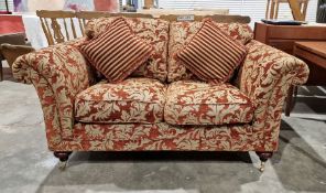20th century red damask two-seater sofa on turned supports and castors