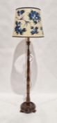 Turned wooden standard lamp with cream shade with blue painted flowers