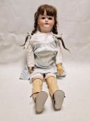 Heinrich Handwerck bisque headed doll with sleeping brown eyes, brown wig, pierced ears and open