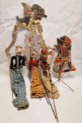 Collection of Far Eastern painted wood puppets with stick operated limbs, a similar flat painted