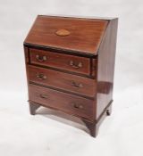 Edwardian mahogany inlaid bureau, the fall front enclosing drawers and pigeonholes, on three long