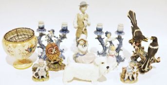 Nao-style figure of a young gentleman holding a duck, a Nao figure of a small girl sitting on a