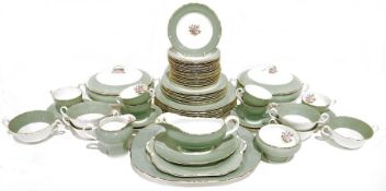 Part dinner service labelled 'Athol Fine Bone China, made in England' with pale turquoise rim and