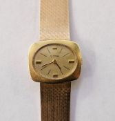 14ct gold Cyma lady's wristwatch, the rounded rectangular face with oval gold dial, integral