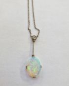 Edwardian opal and diamond lavaliere pendant with collet-set diamond, having bar suspension and