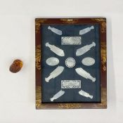 Japanese carved amber netsuke in the form of a fox, 2.5cm high and a small collection of Asian