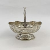 Victorian silver basket with twisted beaded handle, scalloped oval bowl with foliate scroll
