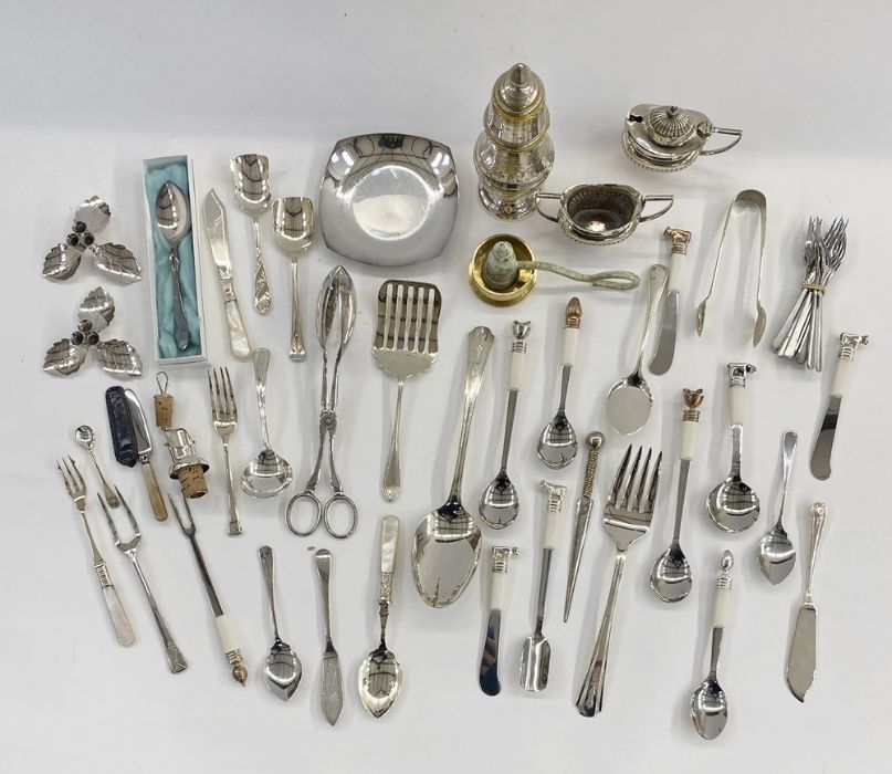 Assorted silver-plated items to include cruet set, sugar tongs, sugar shaker, jam spoons, dessert