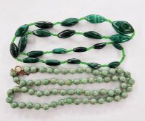 Jade bead necklace with gold-coloured metal clasp and safety chain and string of graduated oval