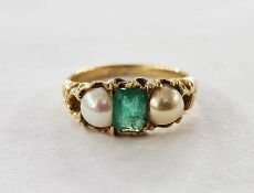 Gold, emerald and pearl ring set centre baguette-cut emerald flanked by pair half pearls