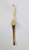 Lady's 9ct gold Tissot watch, the oval champagne face with integral mesh strap, 25.5g total approx.
