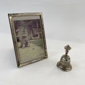 Foreign silver-coloured metal bell marked '13', 8cm high approx., 2ozt approx. and a silver-