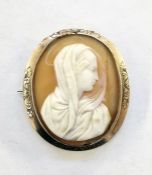 Gilt metal cameo brooch, oval, carved with maiden wearing shawl (shell cracked)