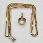9ct gold and pearl set pendant, circular and open with single pearl and small diamond and 9ct gold