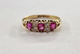Edwardian 18ct gold, ruby and diamond ring set of three oval rubies interspersed by four old-cut