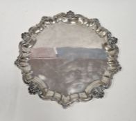 Italian silver waiter (800 mark), circular with raised scroll and scallopshell border, 35cm