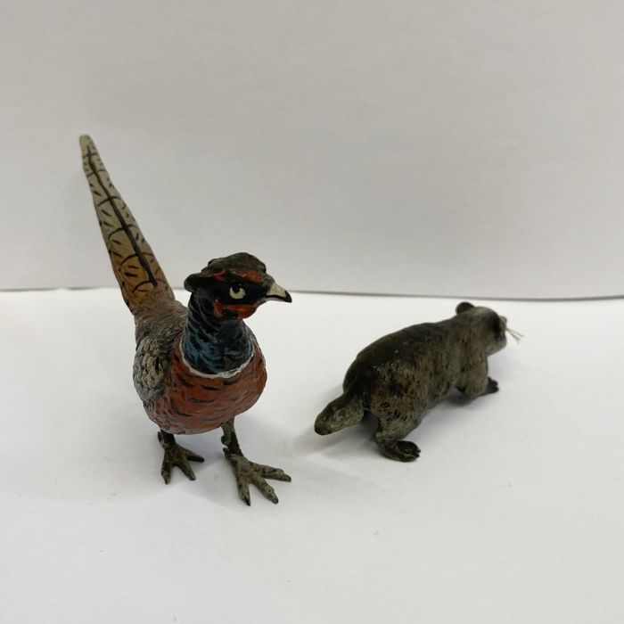 Austrian cold painted bronze models of a cock pheasant, 7.5cm high and a badger with whiskers, 7.