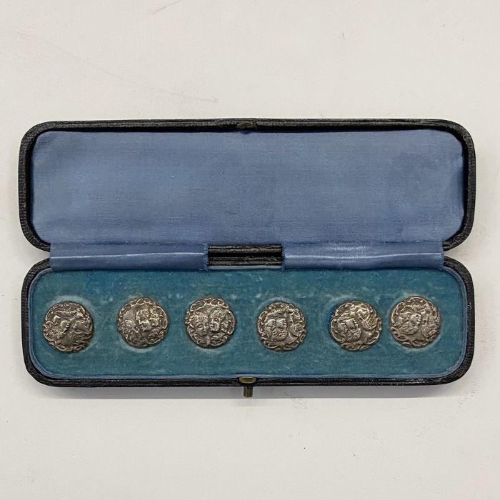 Edwardian silver buttons marked L&S 1904, showing cherub's heads, in likely original box