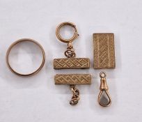 Three various 9ct gold mounts, engraved, a 9ct gold clip (gross weight approx. 5.8g) and a gold-