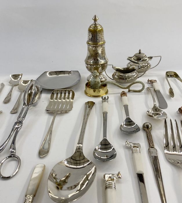 Assorted silver-plated items to include cruet set, sugar tongs, sugar shaker, jam spoons, dessert - Image 4 of 8