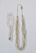 Seed pearl necklace within six strands, with gold-coloured metal fine chain clasp and length of